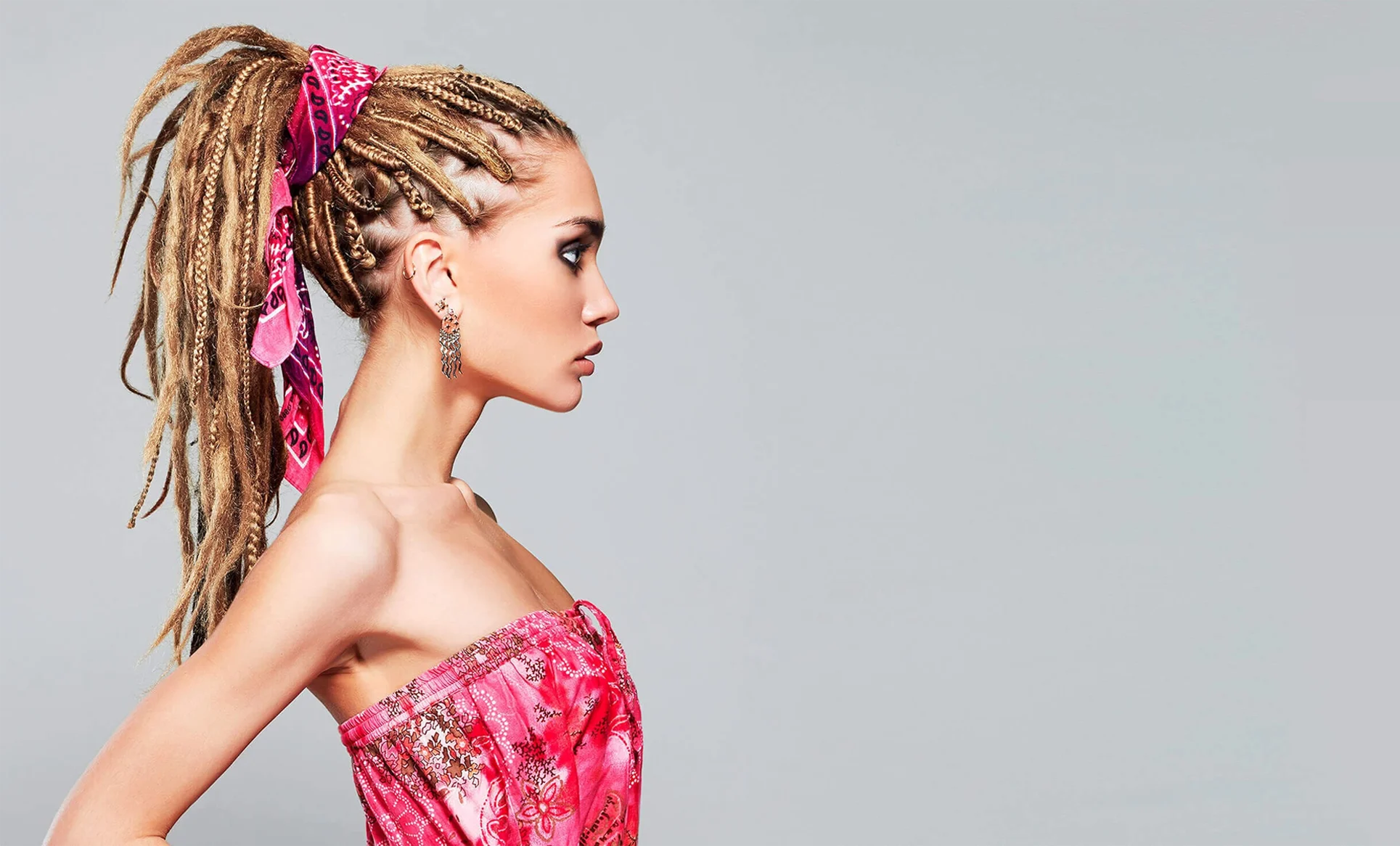 Fashion model wearing a vivid pink summer outfit